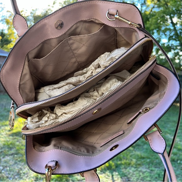 Cute Michael Kors pink bag. Holds a lot of stuff. Has three compartments. - Picture 5 of 7